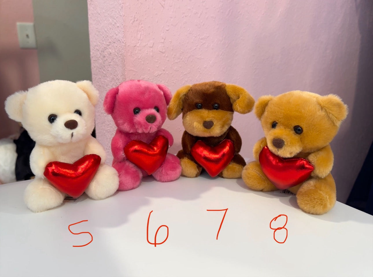 Small bear holding heart