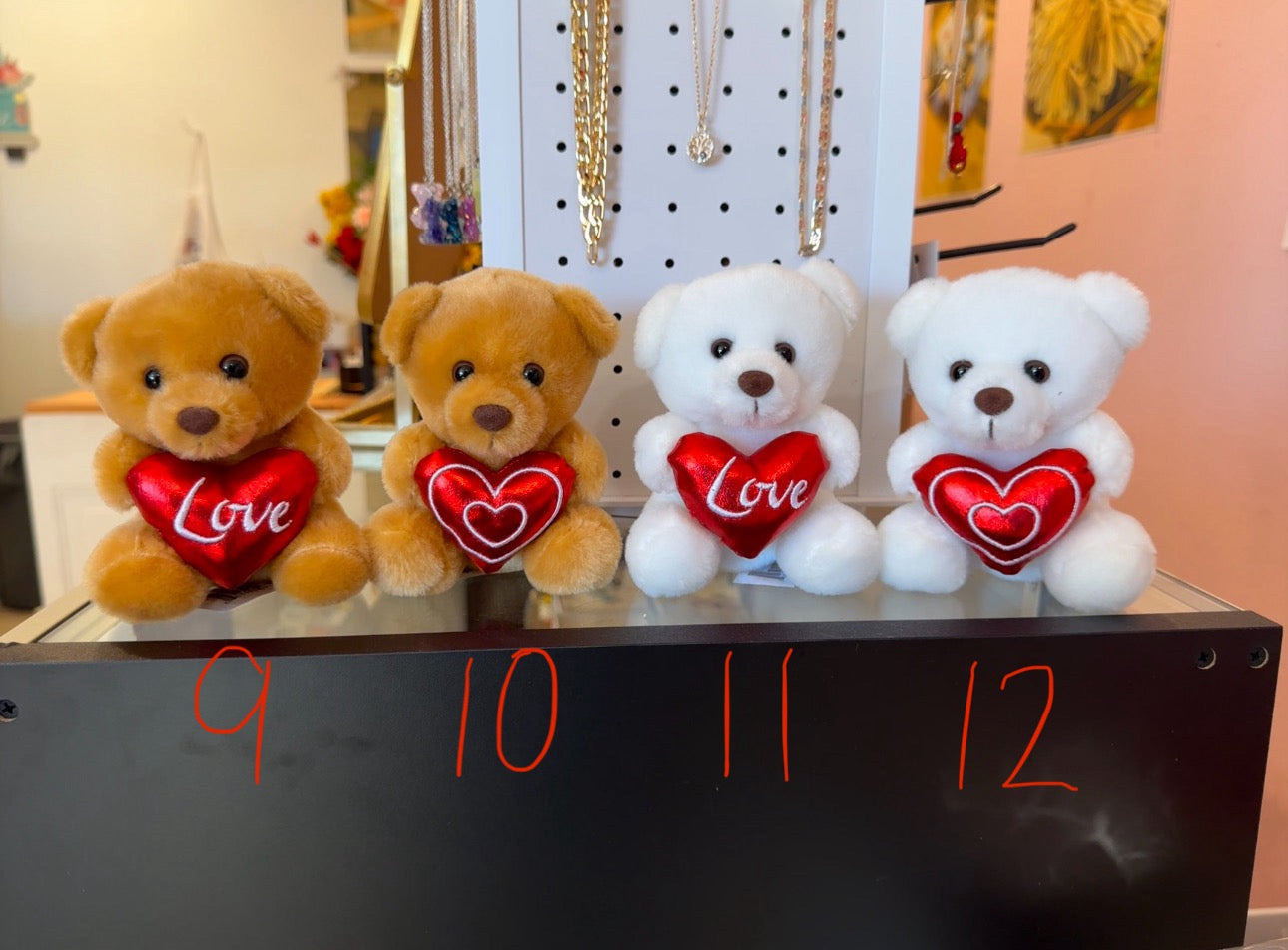 Small bear holding heart