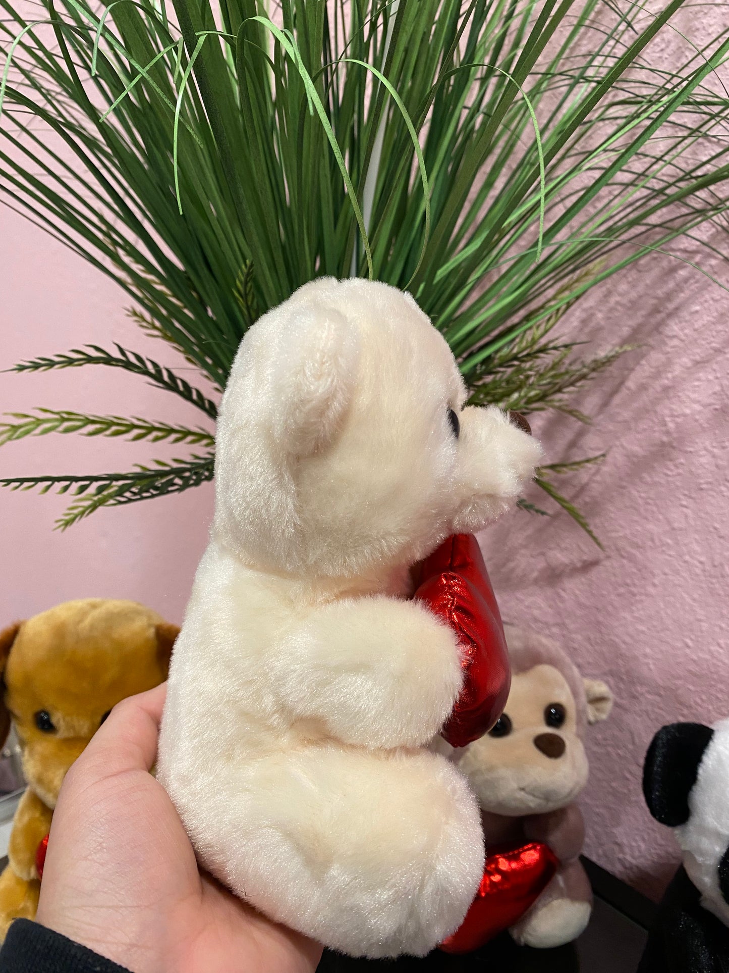 Plushies holding heart