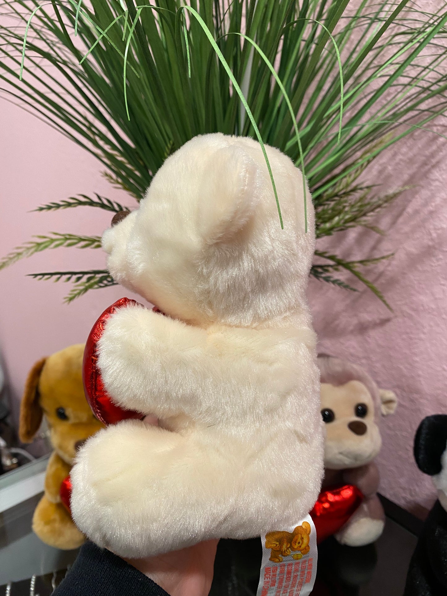 Plushies holding heart
