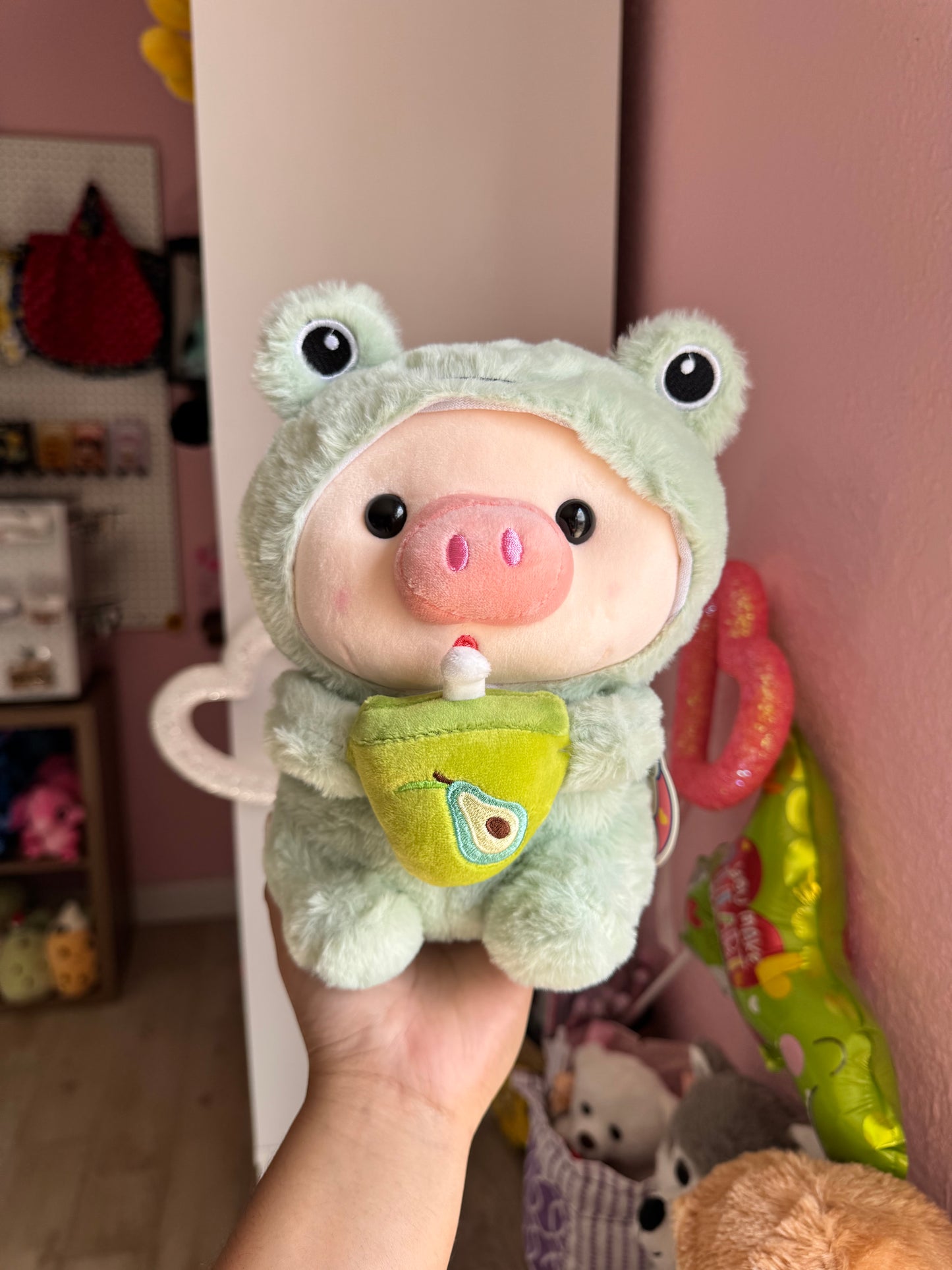 Baby pig in costume with bubble tea