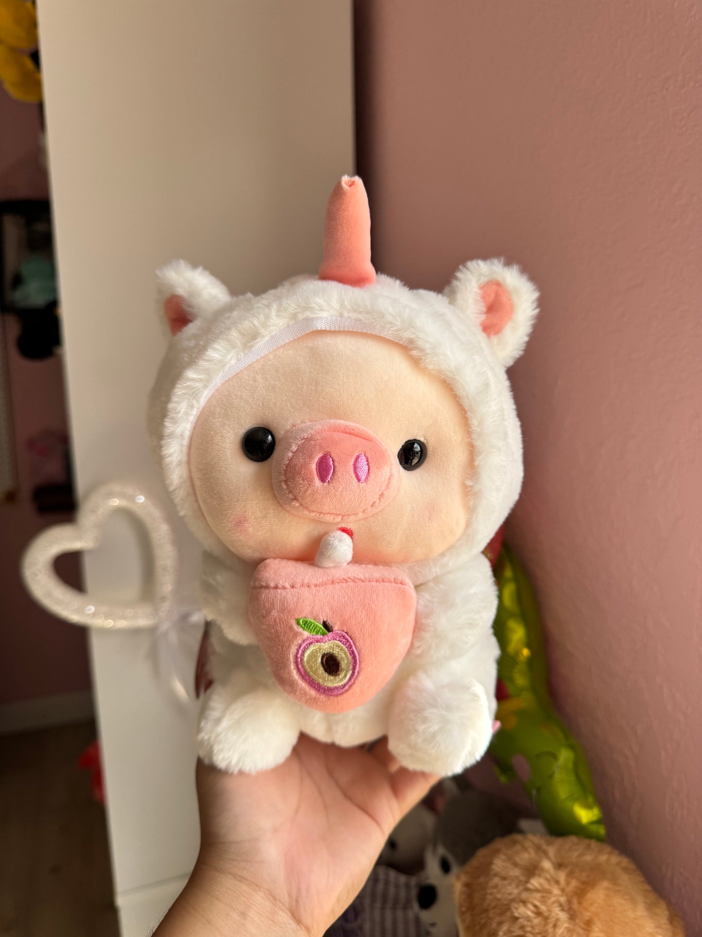 Baby pig in costume with bubble tea